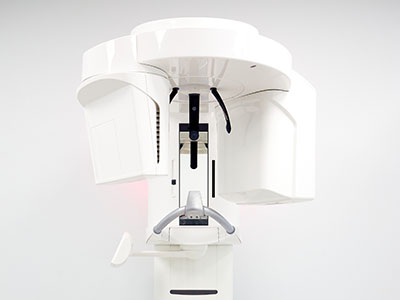 An MRI machine with a control panel and a monitor screen.